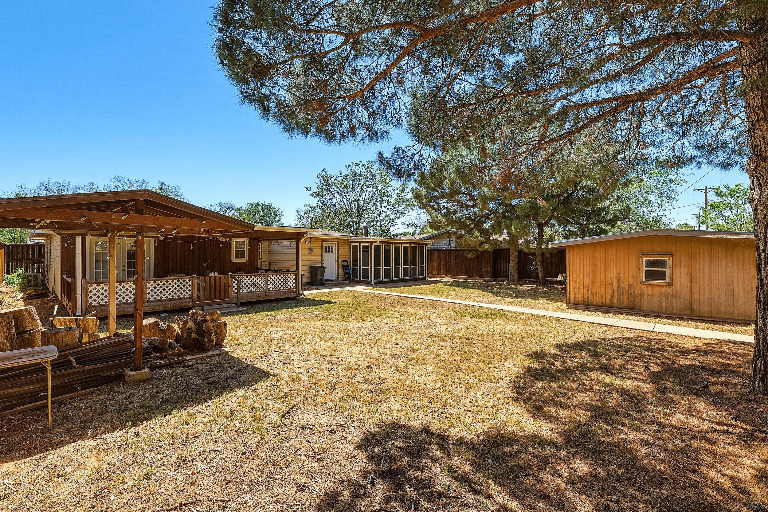 4210 44th Street Lubbock, TX 79413 - Photo 26 of 28 a front view of a house with a yard