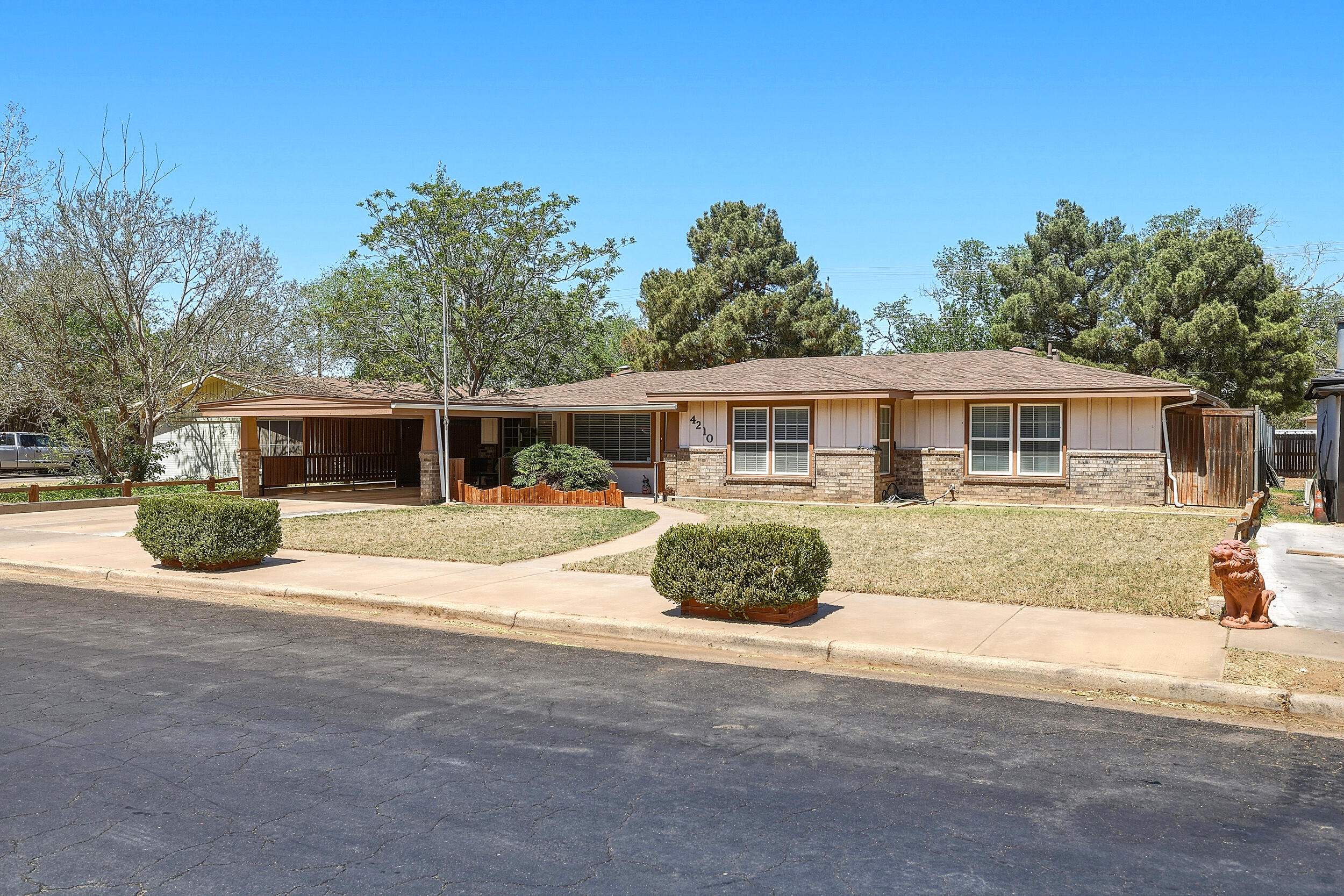 4210 44th Street Lubbock, TX 79413 - Photo 3 of 28 a front view of house with yard and green space