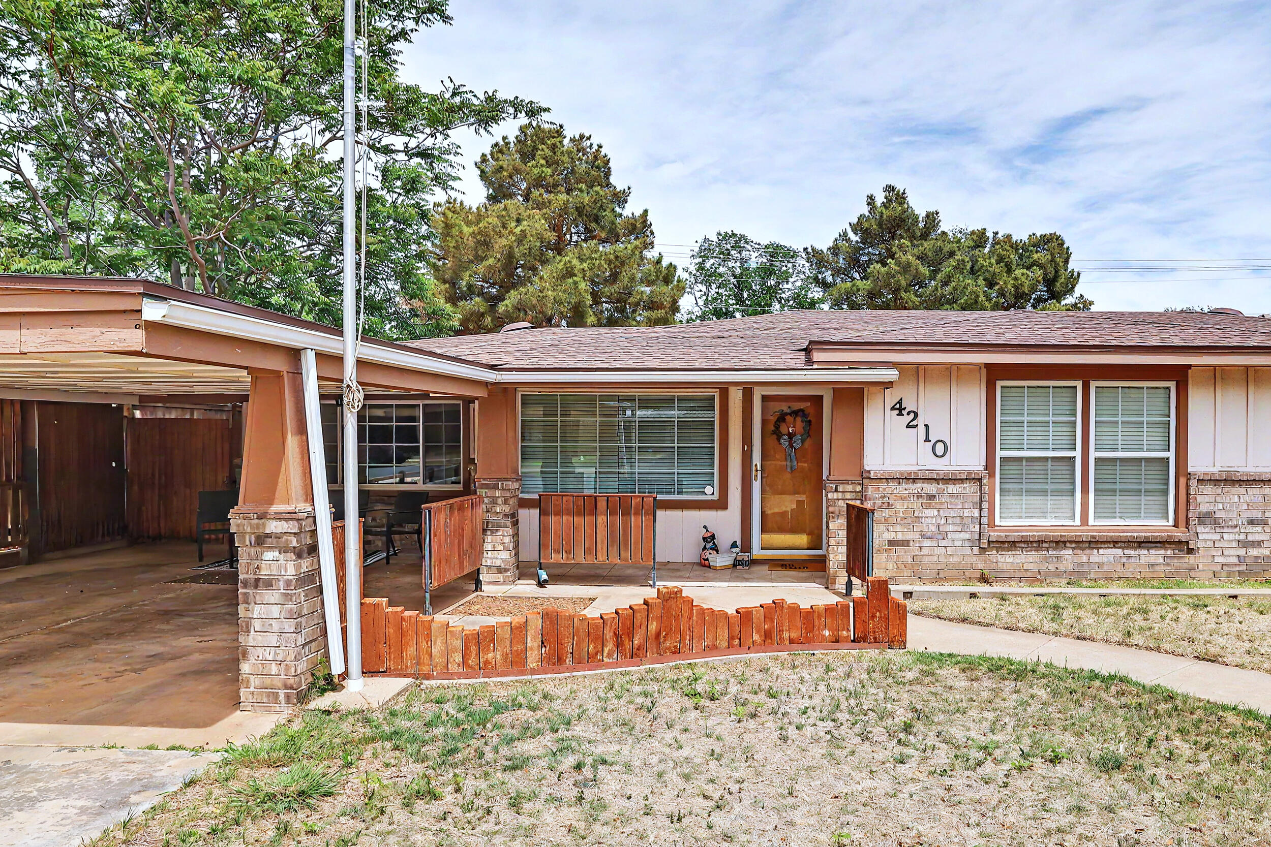 4210 44th Street Lubbock, TX 79413 - Photo 4 of 28 front view of a house with a patio