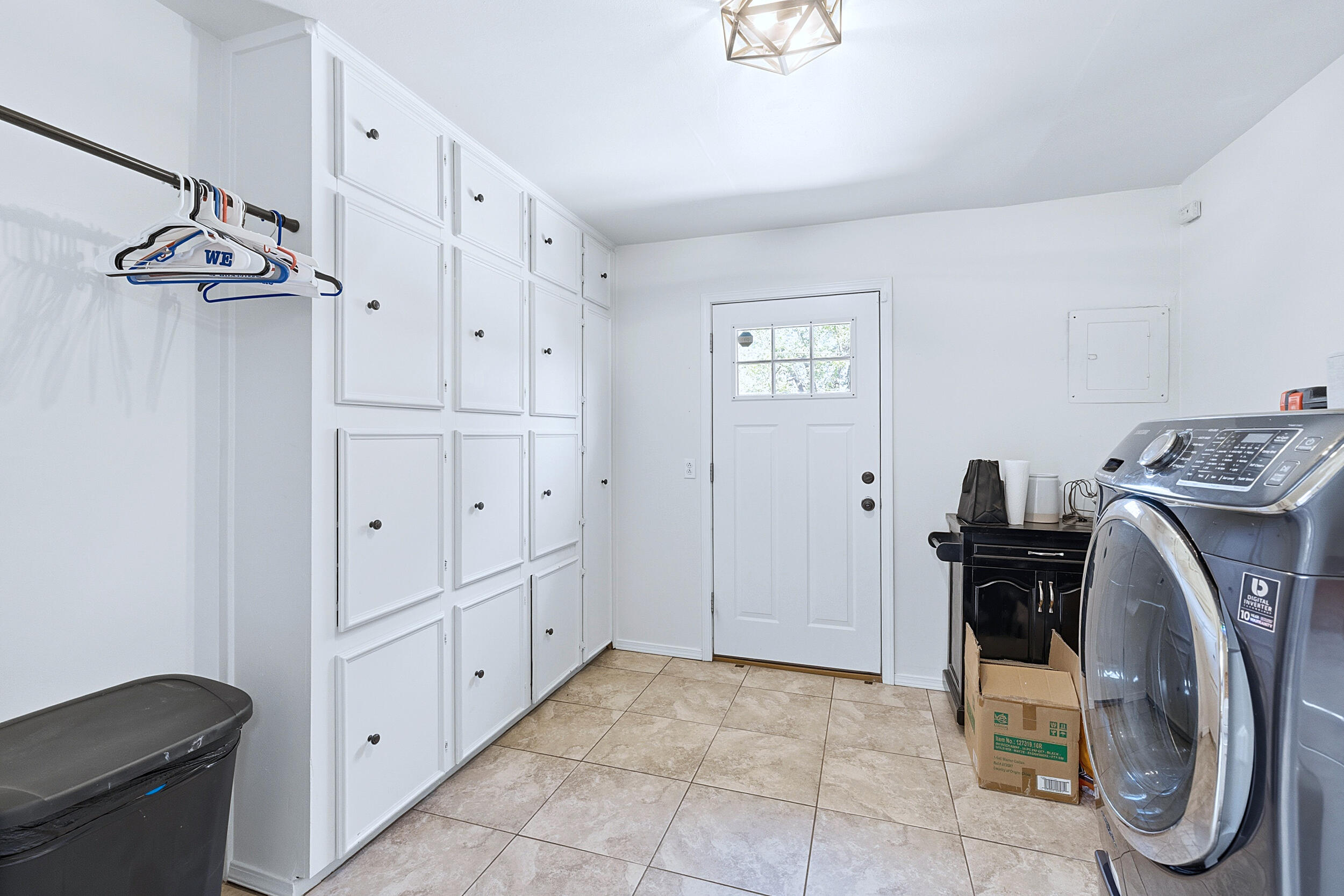 4210 44th Street Lubbock, TX 79413 - Photo 10 of 28 a view of a storage & utility room with washer and dryer