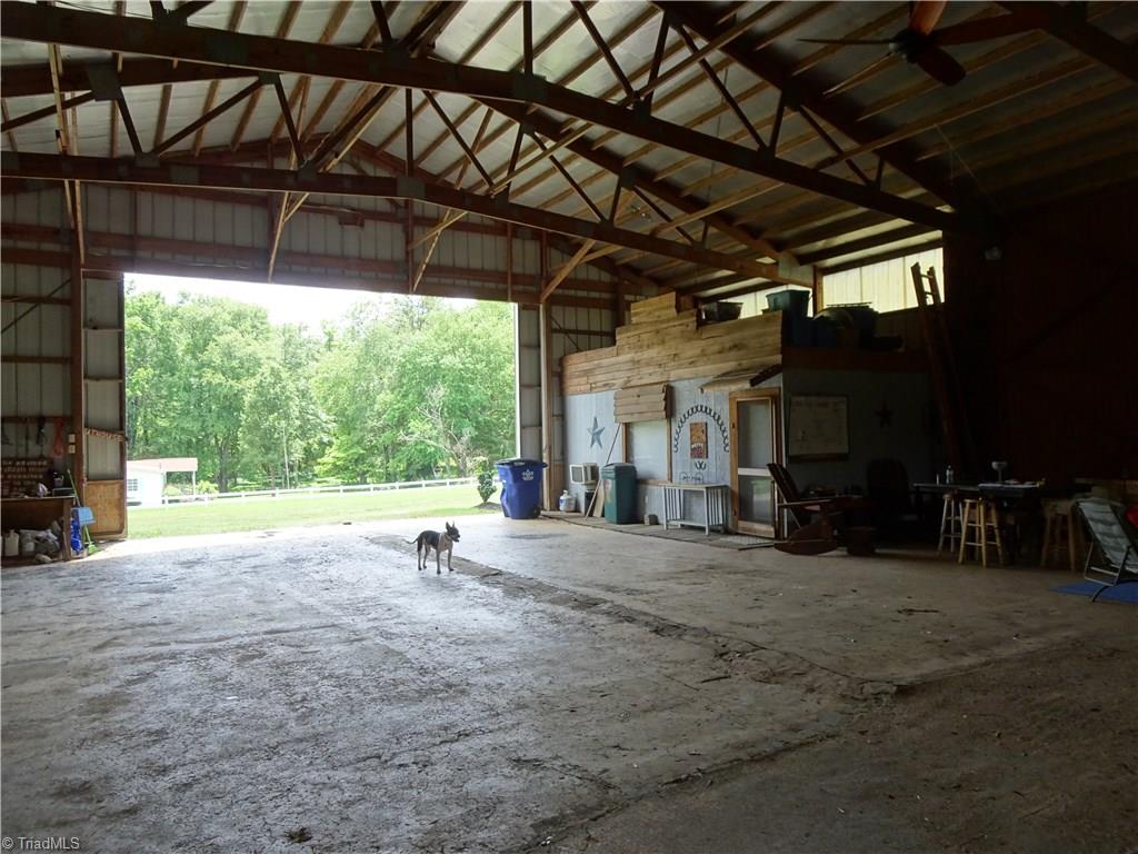 159 Nicholson Road Winston-Salem, NC 27107 - Photo 2 of 28 Tons of space with concrete flooring. 1 BR 1 BA apartment opens into barn.