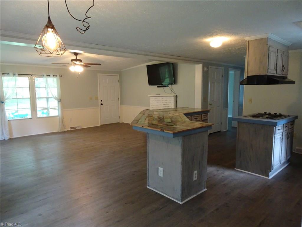 159 Nicholson Road Winston-Salem, NC 27107 - Photo 23 of 28 Another view of great room, with kitchen island. Cooktop, wall oven, refrigerator, w/d. 2 large bedrooms, updated bathrooms, 2 yr old HVAC