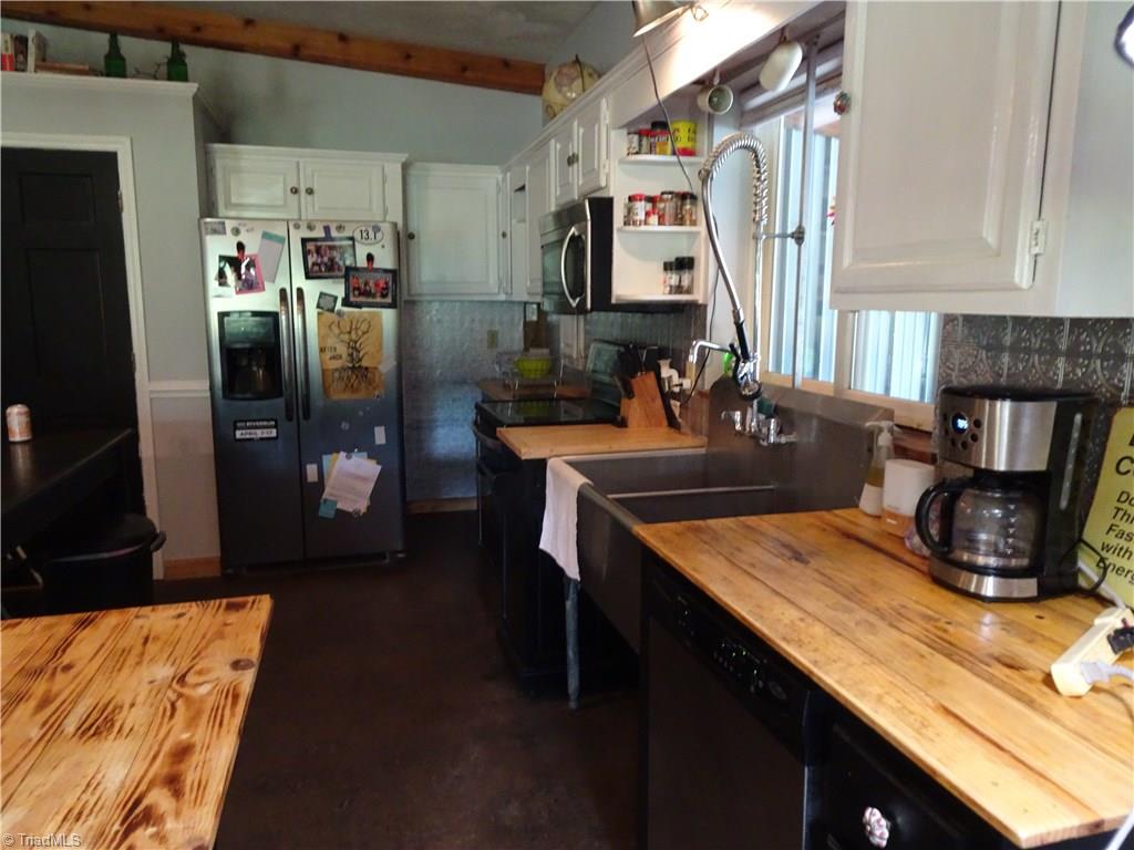 159 Nicholson Road Winston-Salem, NC 27107 - Photo 10 of 28 lots of counterspace, commercial stainless steel sink, gas cooktop + separate smoothtop range/oven.