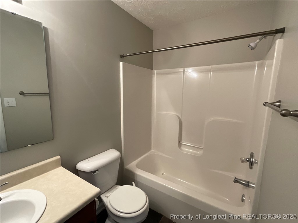 209 Pecan Trace Road Raeford, NC 28376 - Photo 11 of 24 a bathroom with a toilet and a shower