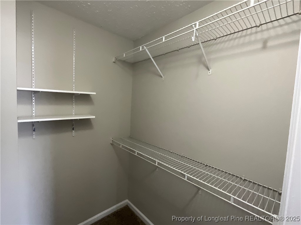 209 Pecan Trace Road Raeford, NC 28376 - Photo 16 of 24 a view of a room with racks on the wall