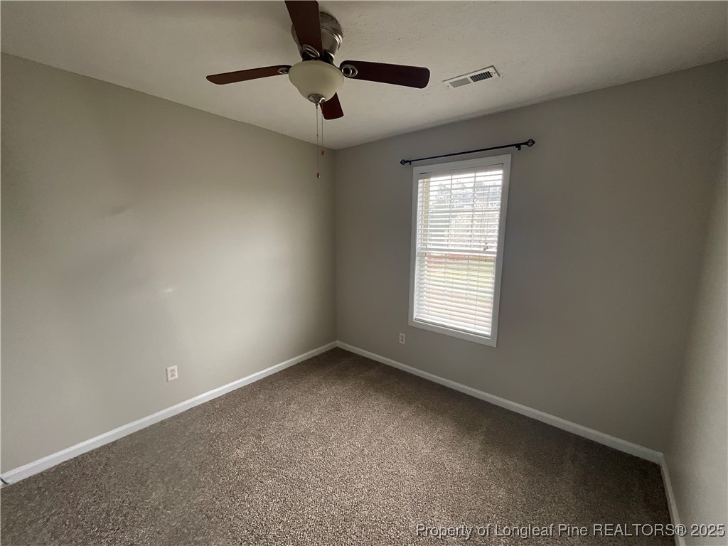 209 Pecan Trace Road Raeford, NC 28376 - Photo 18 of 24 a view of an empty room with a window