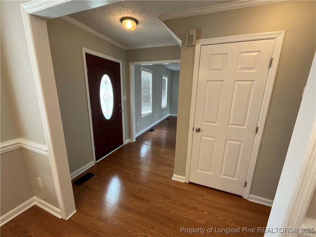 209 Pecan Trace Road Raeford, NC 28376 - Photo 2 of 24 an entryway with wooden floor