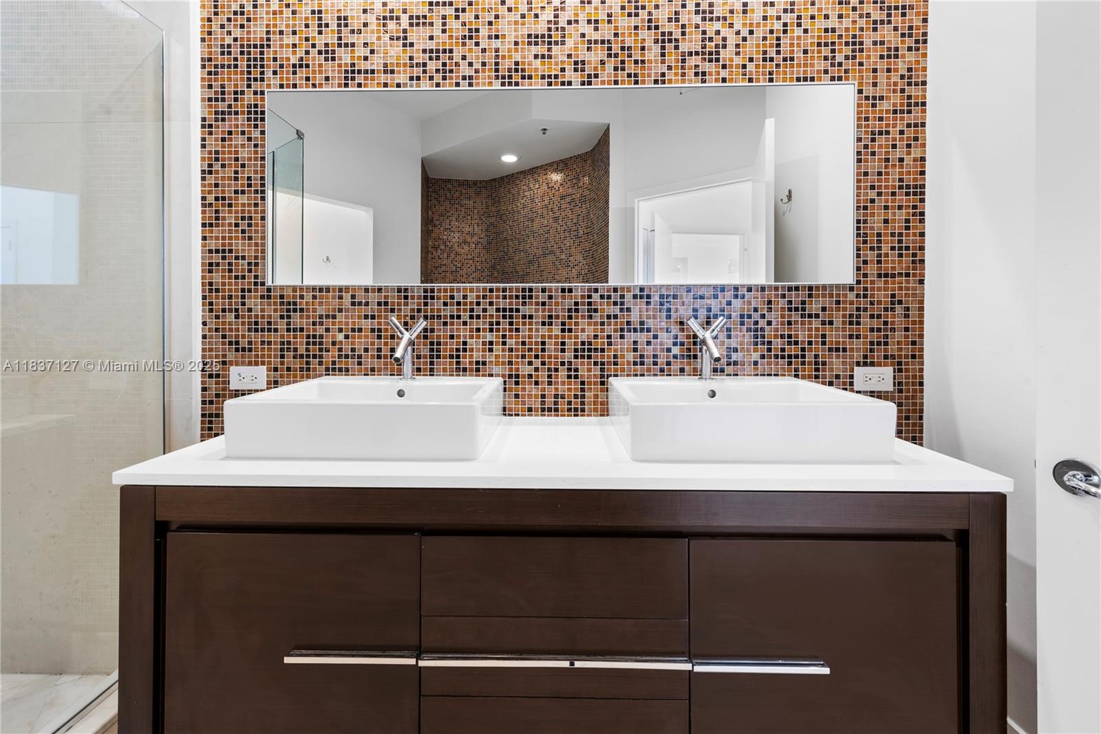 Brickell Miami, FL 33131 - Photo 38 of 65 a bathroom with a sink and a mirror