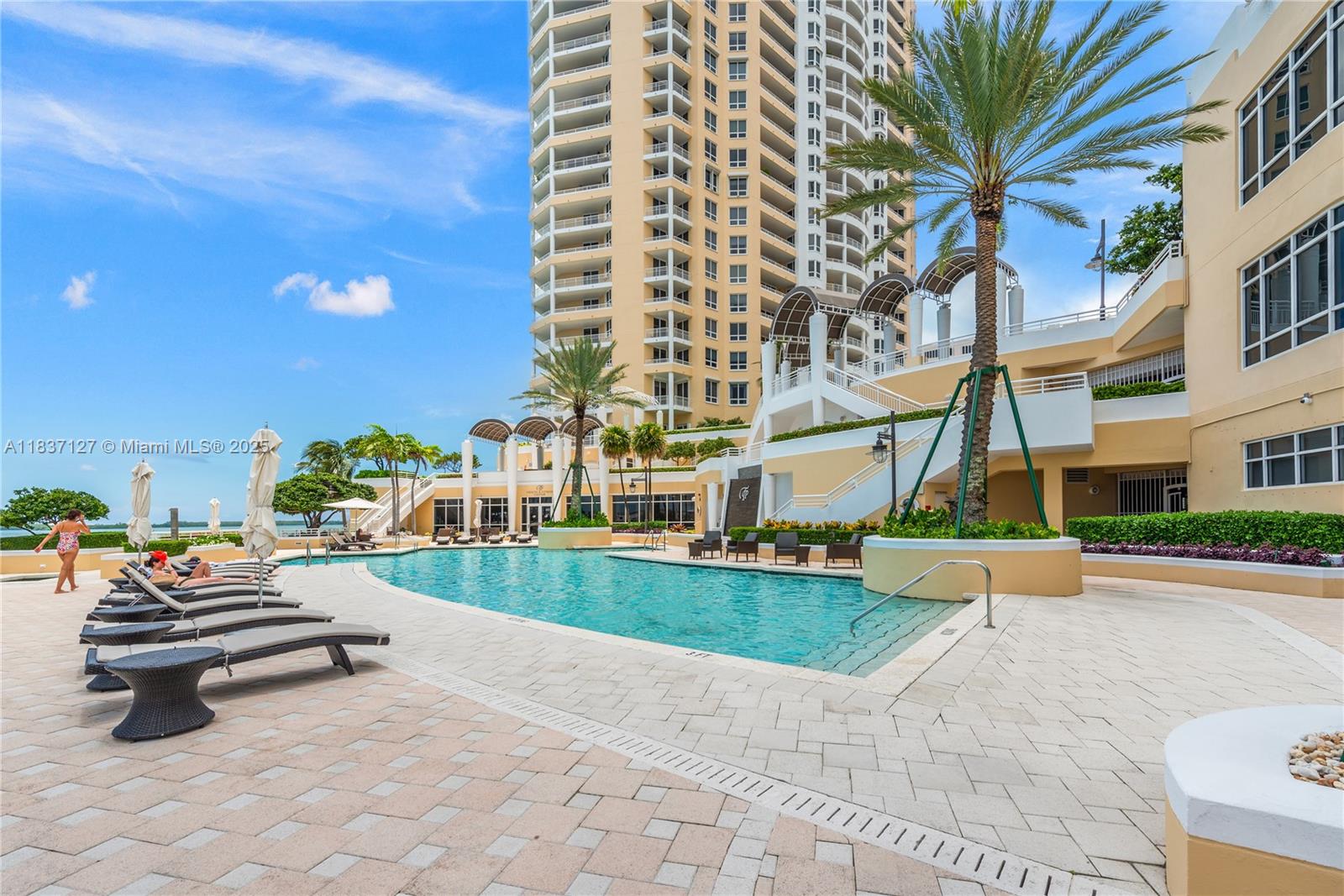 Brickell Miami, FL 33131 - Photo 61 of 65 a bench is sitting in front of a building