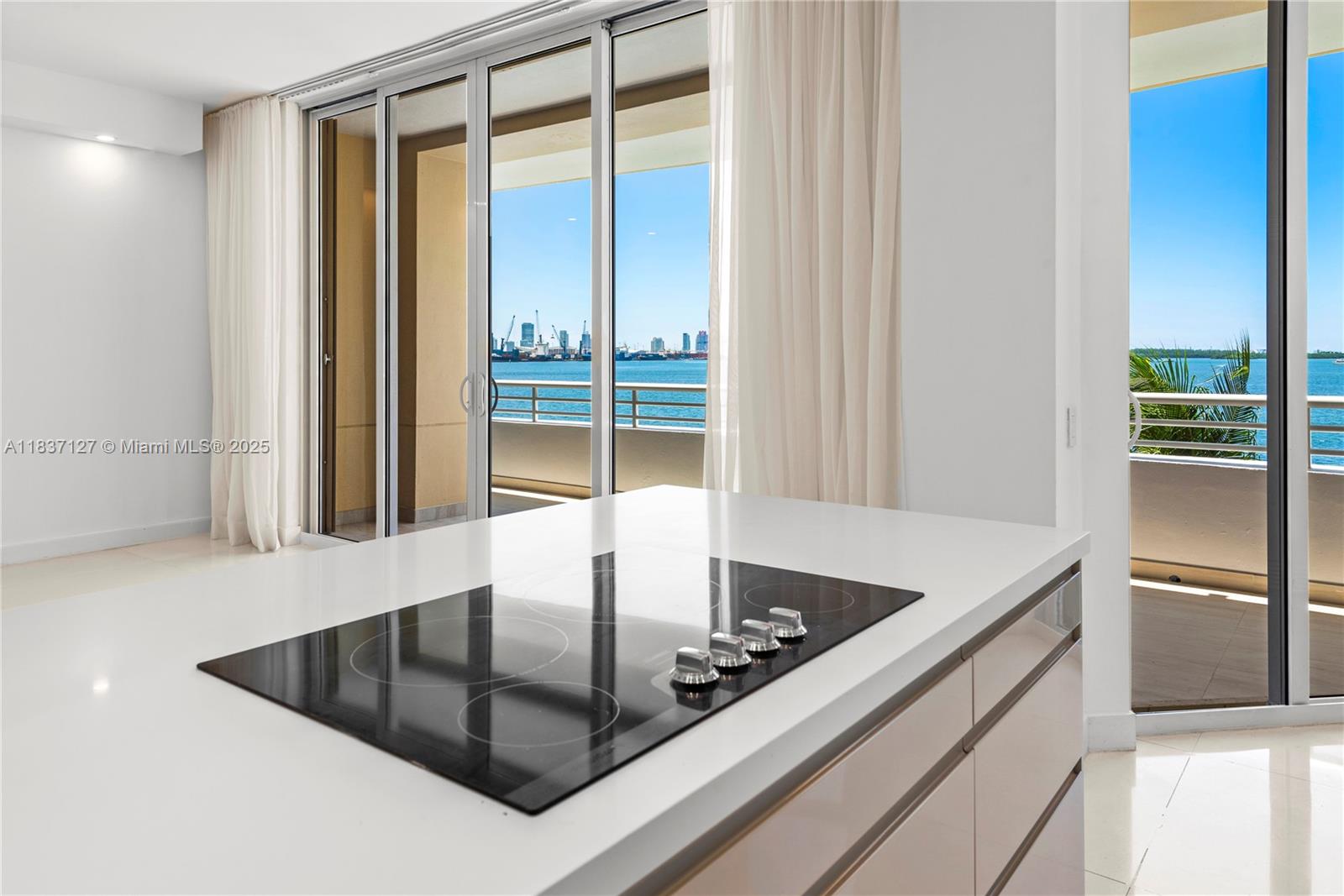 Brickell Miami, FL 33131 - Photo 9 of 65 a kitchen with a sink and a refrigerator