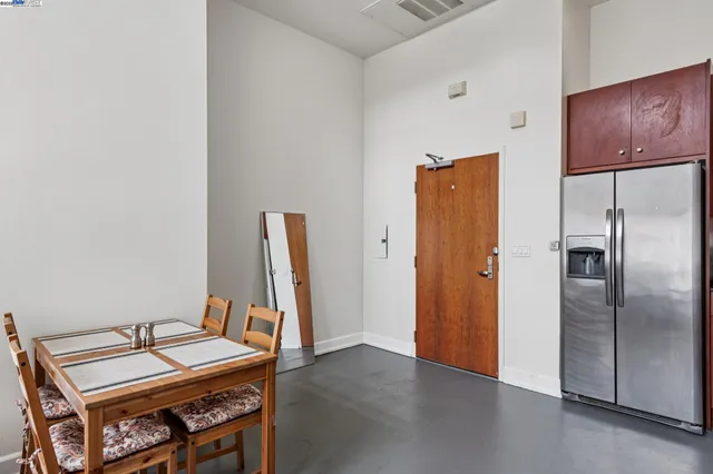 a view of a room with furniture and wooden floor