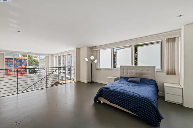 a bathroom with a tub a sink and a large mirror