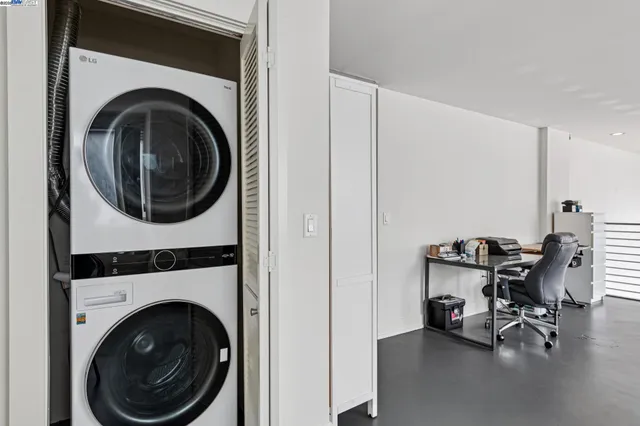a view of a livingroom with furniture and a kitchen