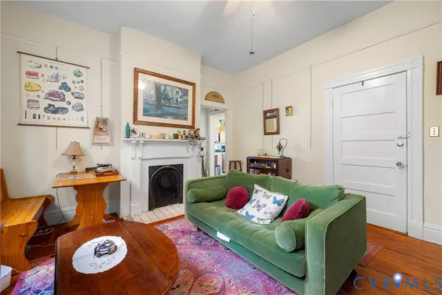 a living room with furniture and a fireplace