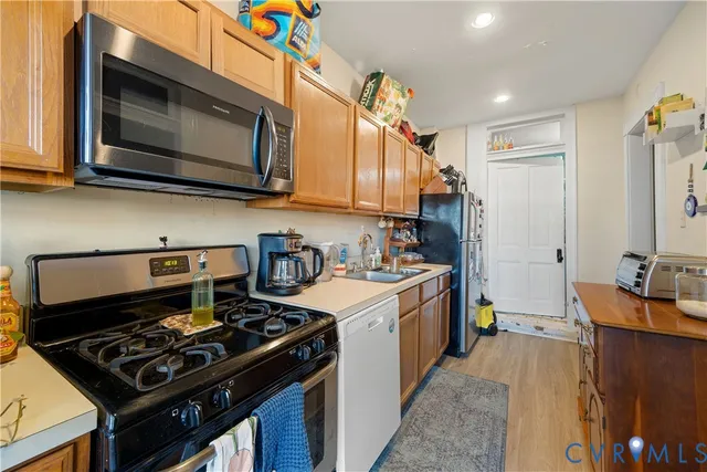 a kitchen with a stove and a microwave