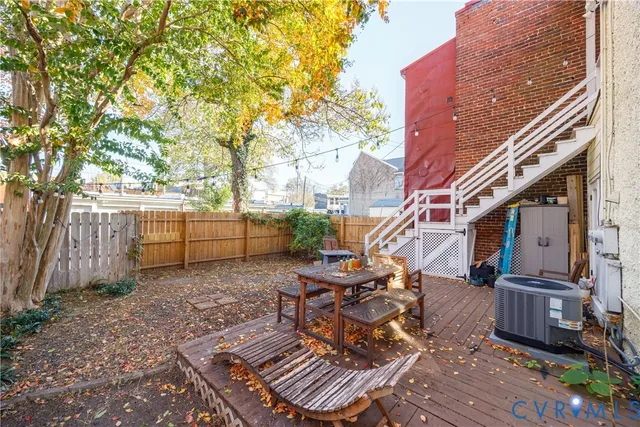 a view of a house with a large tree