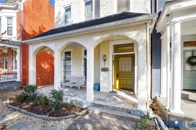 a front view of a house with a porch