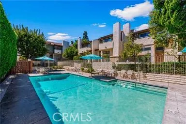 a view of a garden with a building