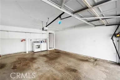 a kitchen with stainless steel appliances granite countertop a sink dishwasher a stove and a microwave oven with cabinets