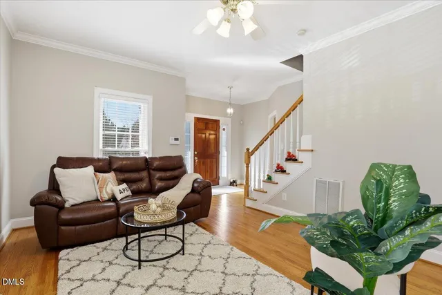 a view of a dining room with furniture wooden floor and a chandelier