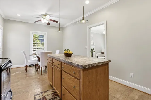 a bedroom with a bed and a flat tv screen on dresser