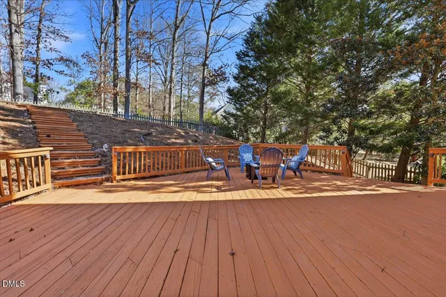 a living room with furniture a fireplace and a table