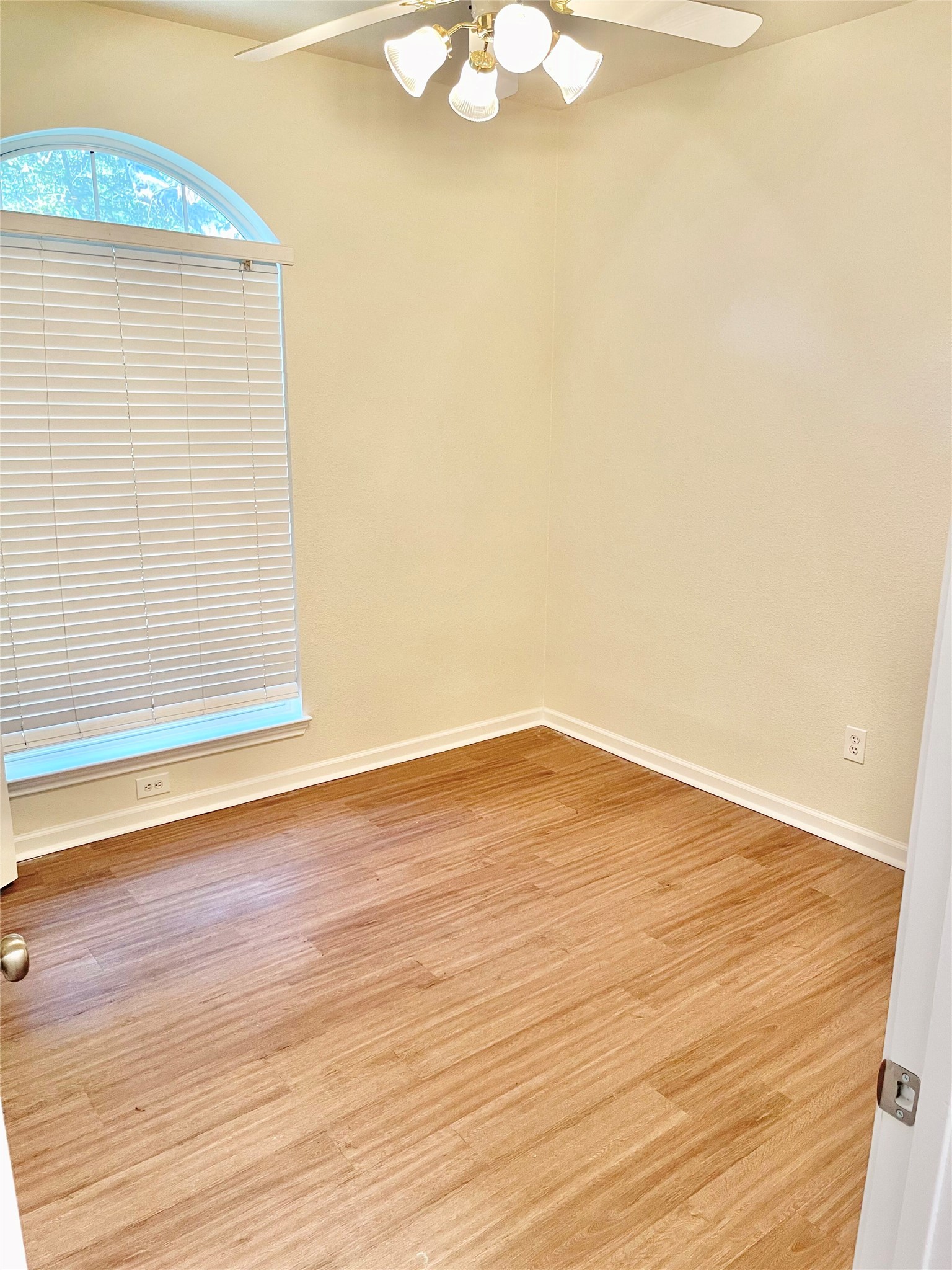 12513 Wethersby Way Austin, TX 78753 - Photo 12 of 16 Second room with a ceiling fan and light wood flooring