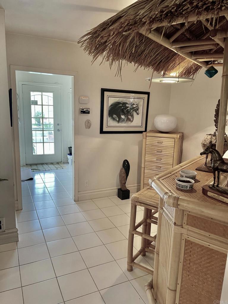 2357 Vía Monserate Fallbrook, CA 92028 - Photo 13 of 28 a view of a entryway with furniture and floor to ceiling window