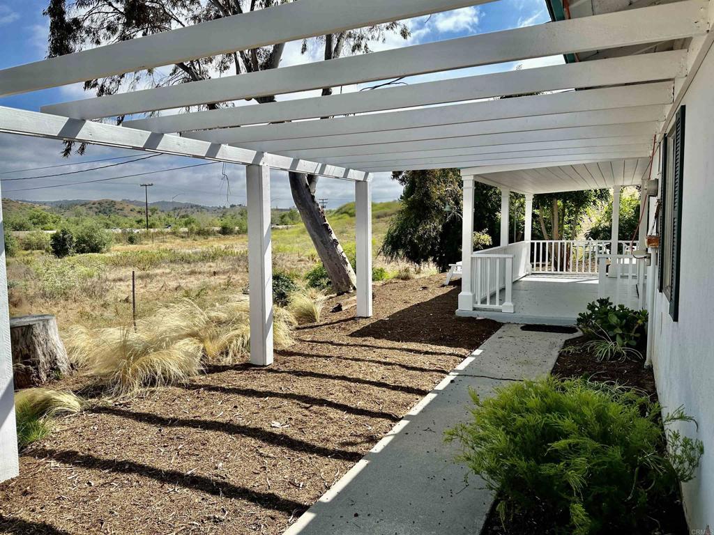 2357 Vía Monserate Fallbrook, CA 92028 - Photo 9 of 28 a view of a porch with a bench