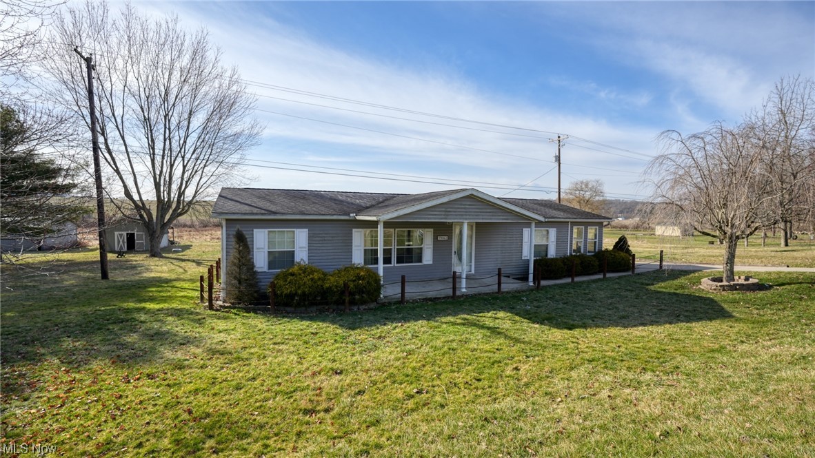 59062 Marietta Road Byesville, OH 43723 - Photo 29 of 33 Ranch-style house featuring a front yard, covered porch, and a storage shed