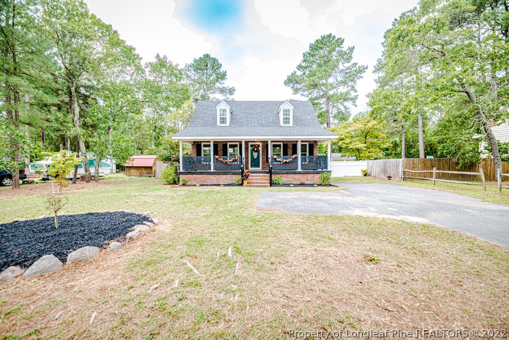 110 Cypress Road Cameron, NC 28326 - Photo 1 of 35 a view of a house with a yard and sitting area