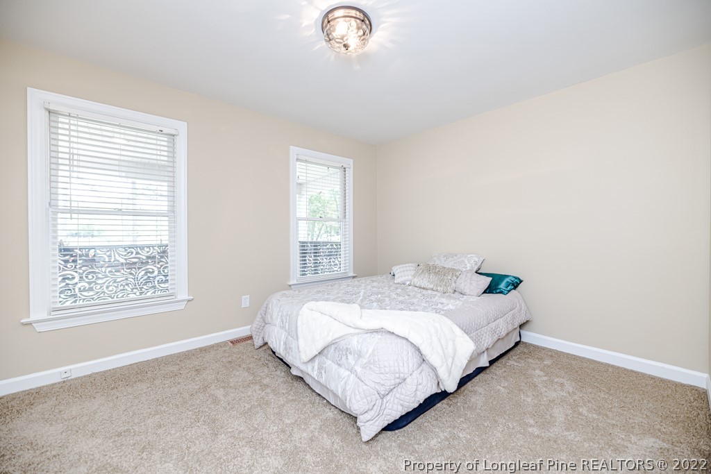 110 Cypress Road Cameron, NC 28326 - Photo 18 of 35 a bedroom with a bed and a window