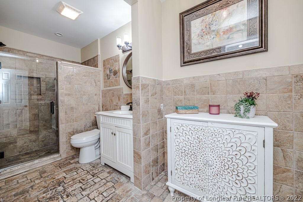 110 Cypress Road Cameron, NC 28326 - Photo 19 of 35 a bathroom with a toilet and a shower