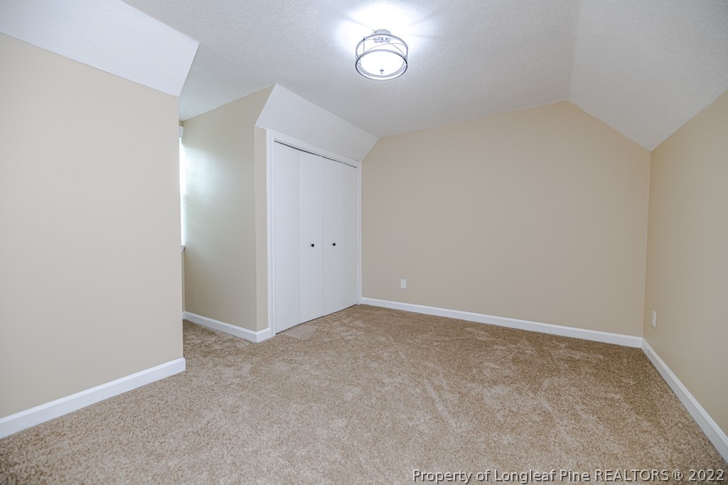 110 Cypress Road Cameron, NC 28326 - Photo 22 of 35 an empty room with a fan and mirror