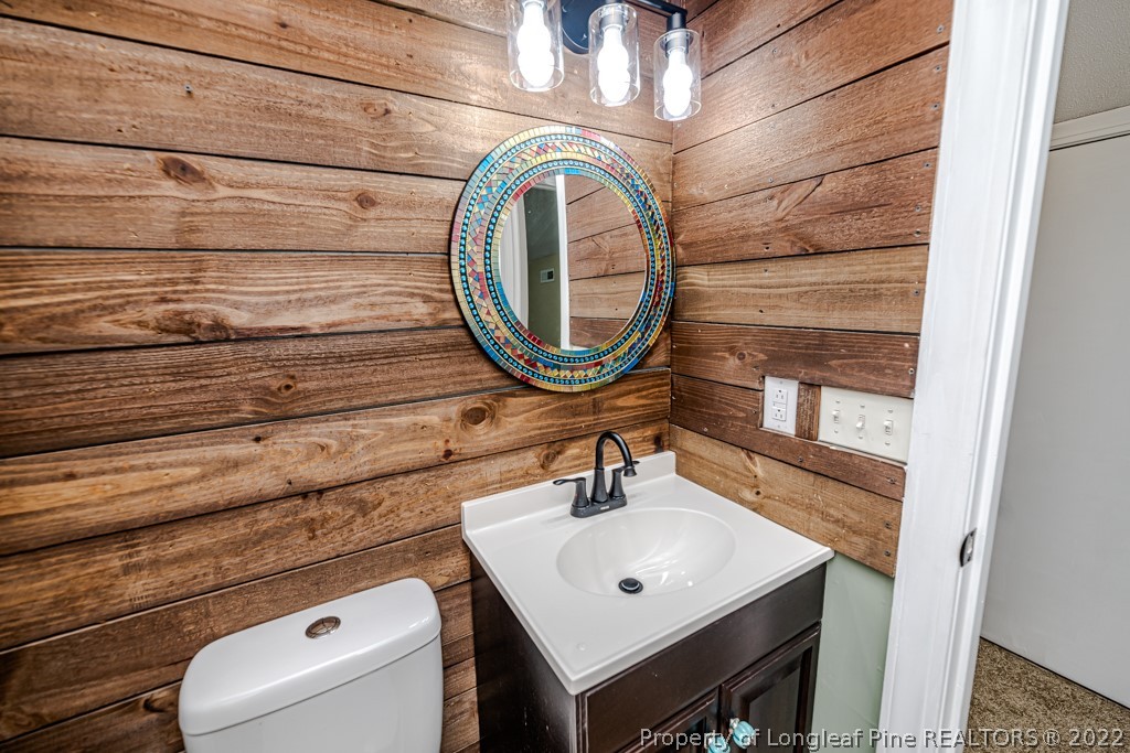 110 Cypress Road Cameron, NC 28326 - Photo 24 of 35 a bathroom with a sink and a mirror