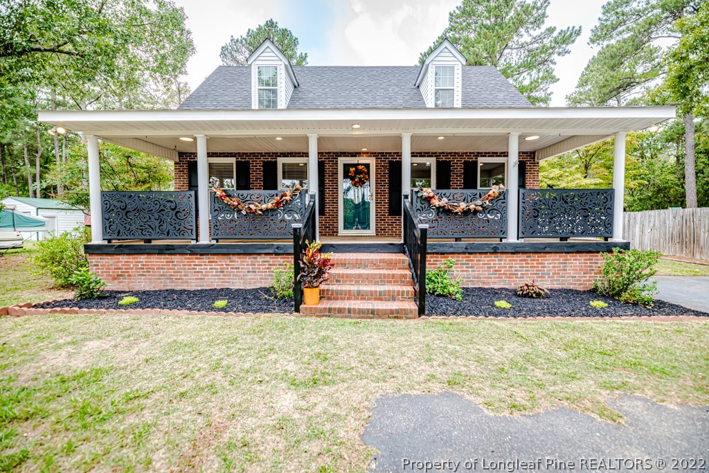 110 Cypress Road Cameron, NC 28326 - Photo 4 of 35 a view of a house with backyard and porch