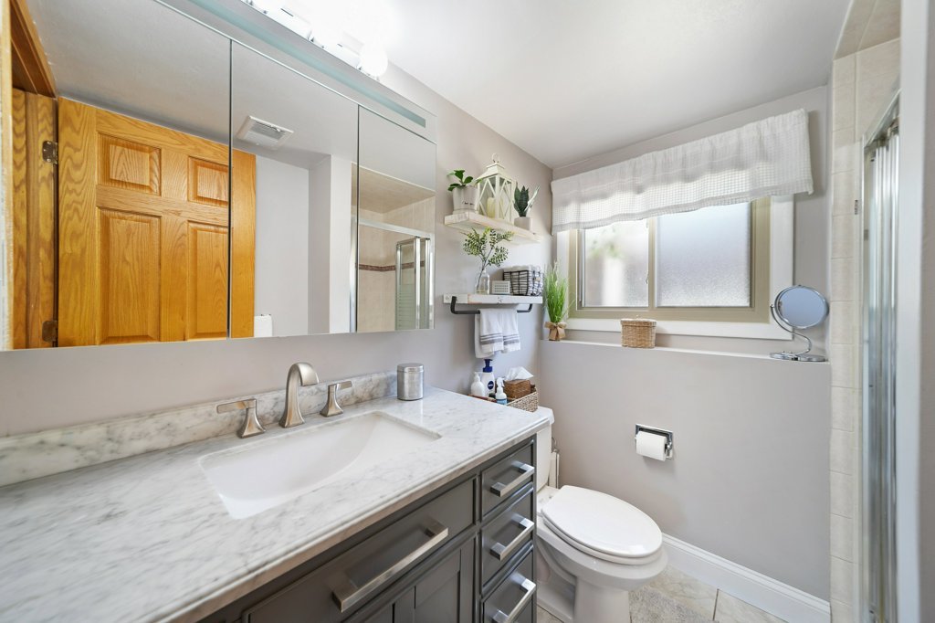 365 West Myrick Avenue Addison, IL 60101 - Photo 27 of 49 a bathroom with a granite countertop sink mirror vanity and toilet