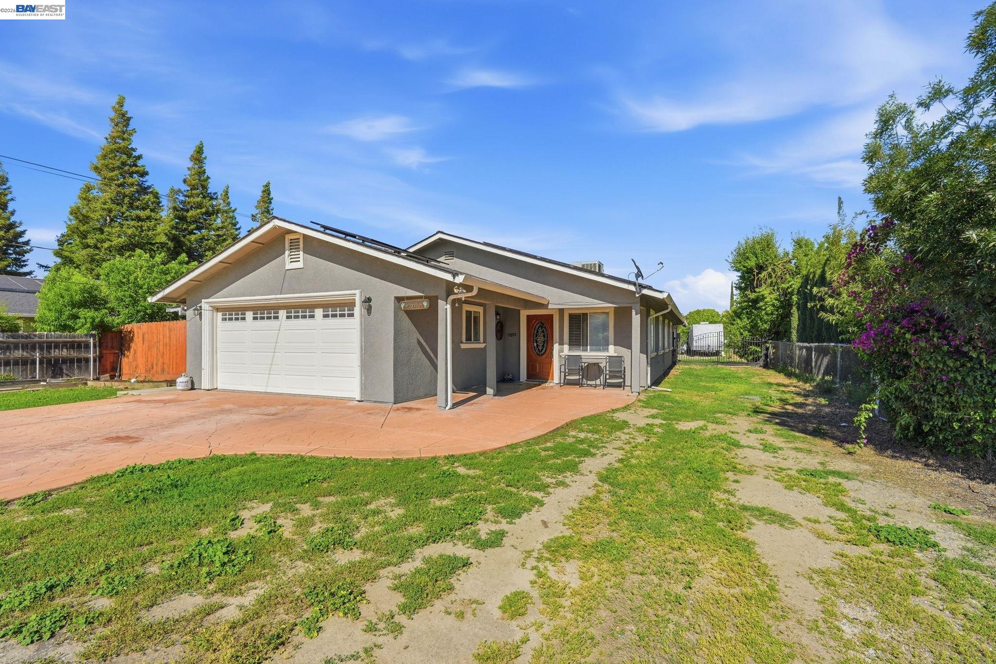10378 South Priest Road French Camp, CA 95231 - Photo 3 of 44 a front view of house with yard and green space