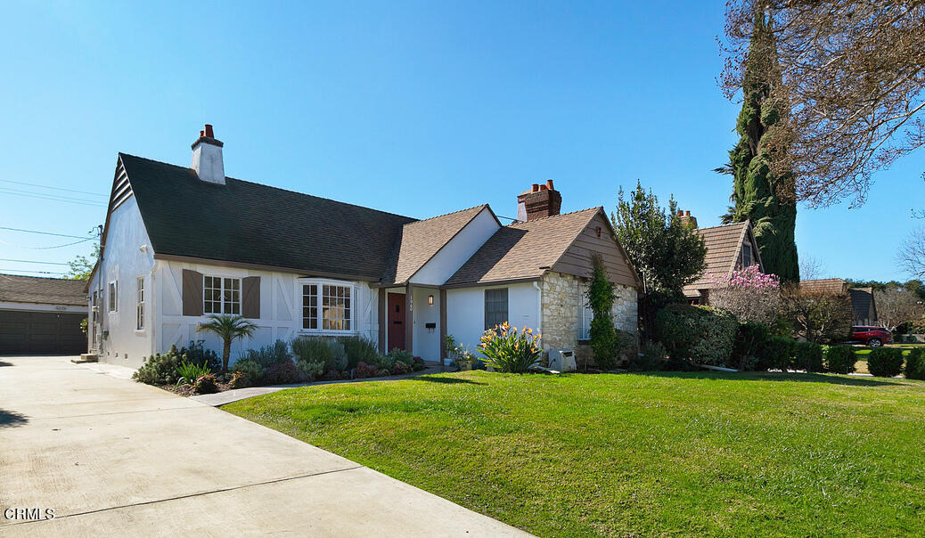 a front view of house with yard and green space
