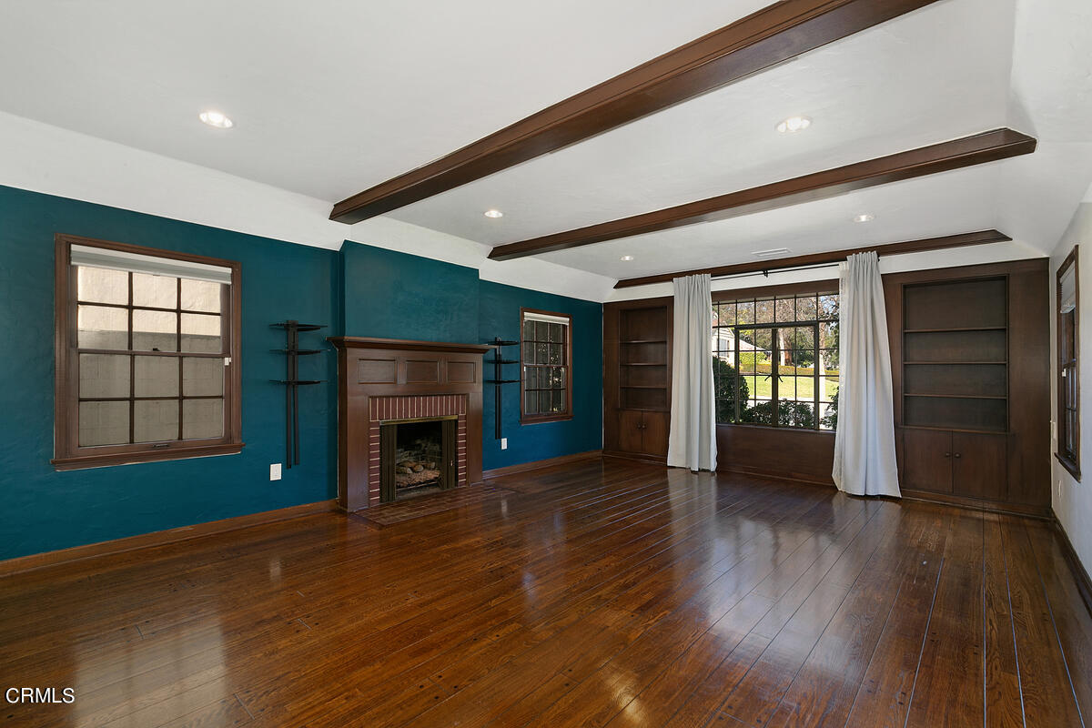 1060 West Roses Road San Gabriel, CA 91775 - Photo 2 of 12 a view of an empty room with window and fire place