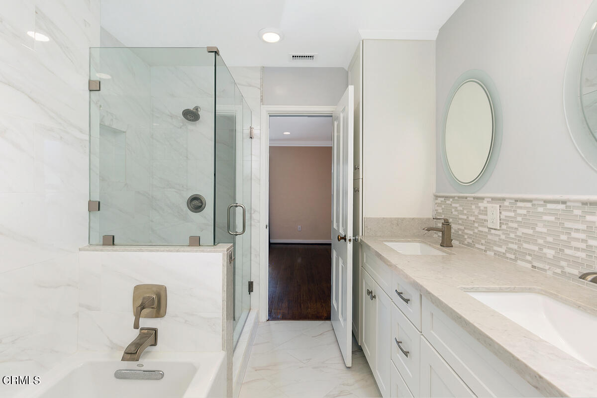 1060 West Roses Road San Gabriel, CA 91775 - Photo 8 of 12 a bathroom with a double vanity sink mirror and shower