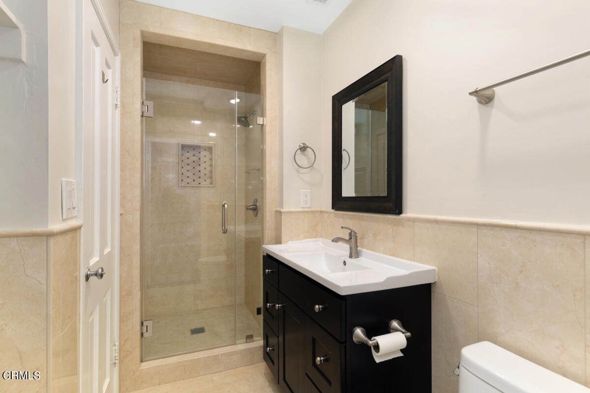 1060 West Roses Road San Gabriel, CA 91775 - Photo 10 of 12 a bathroom with a sink and a mirror