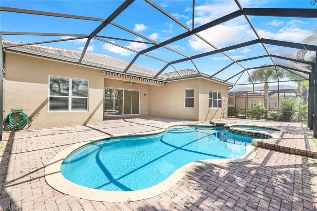 6592 Marbella Lane Naples, FL 34105 - Photo 12 of 18 a view of a house with swimming pool