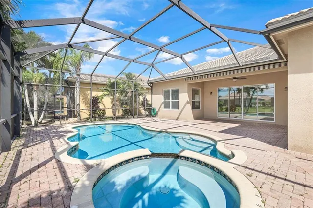 a view of a swimming pool with a patio