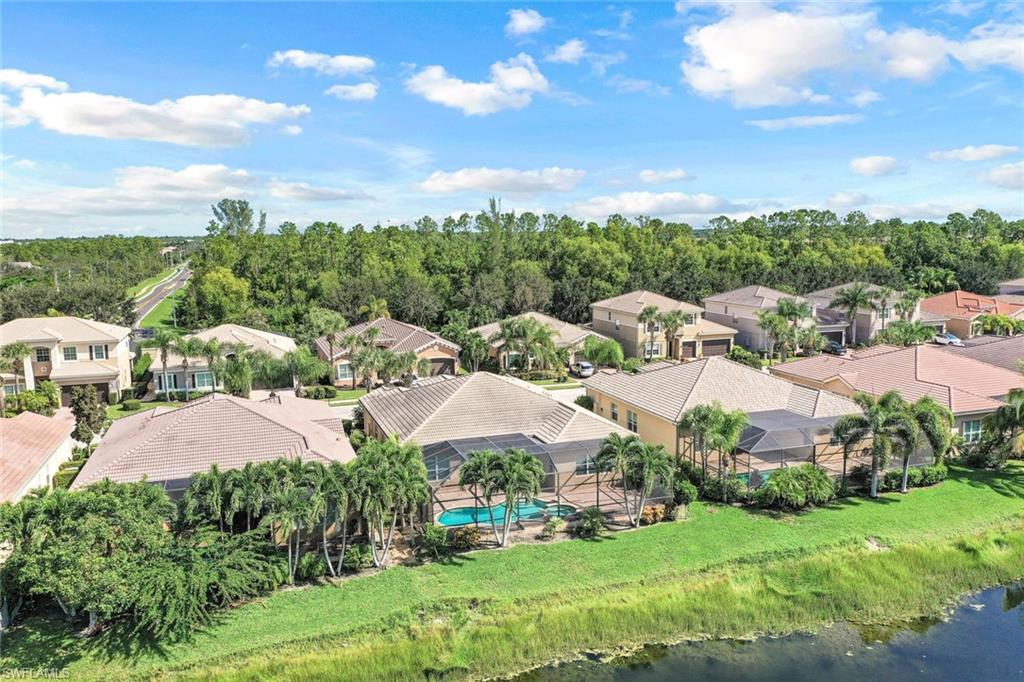 6592 Marbella Lane Naples, FL 34105 - Photo 9 of 18 a view of a garden
