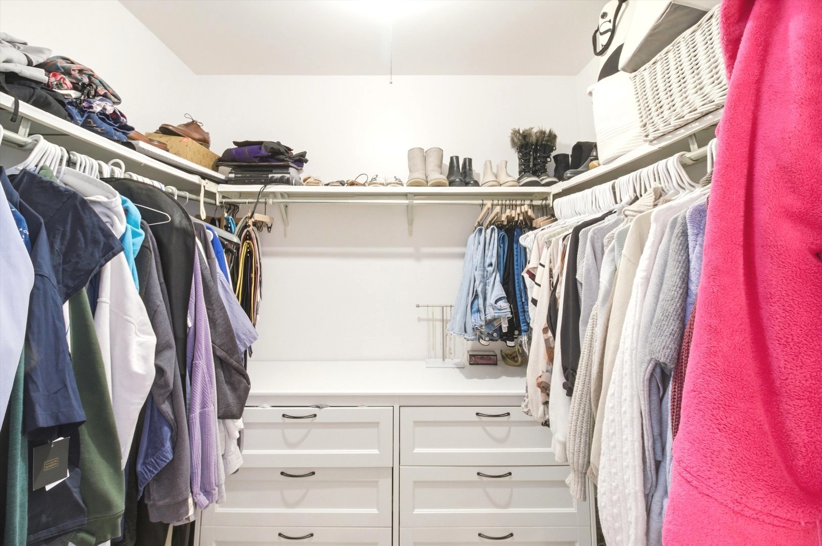 8640 Waukegan Road, Unit 123 Morton Grove, IL 60053 - Photo 23 of 30 a view of walk in closet with clothes and shoes
