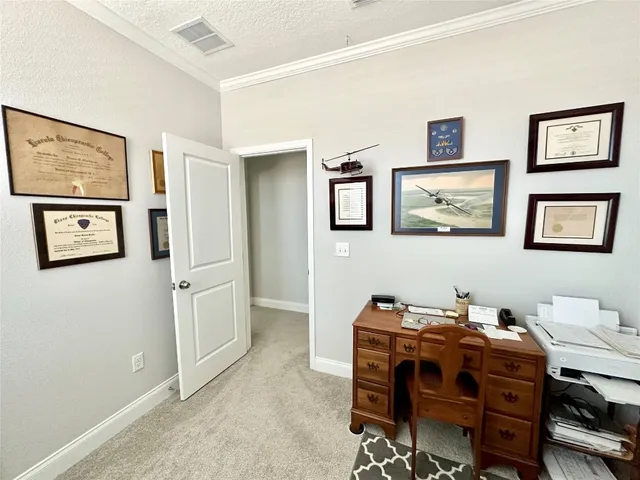 a view of a workspace with furniture