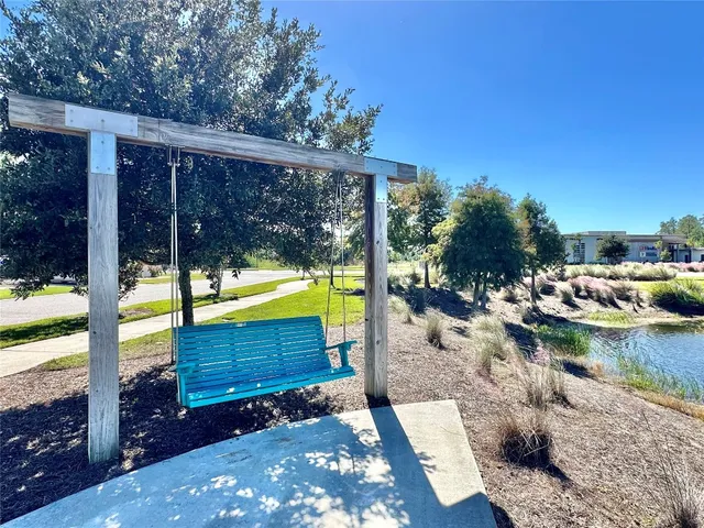 a view of a lake with houses in the back