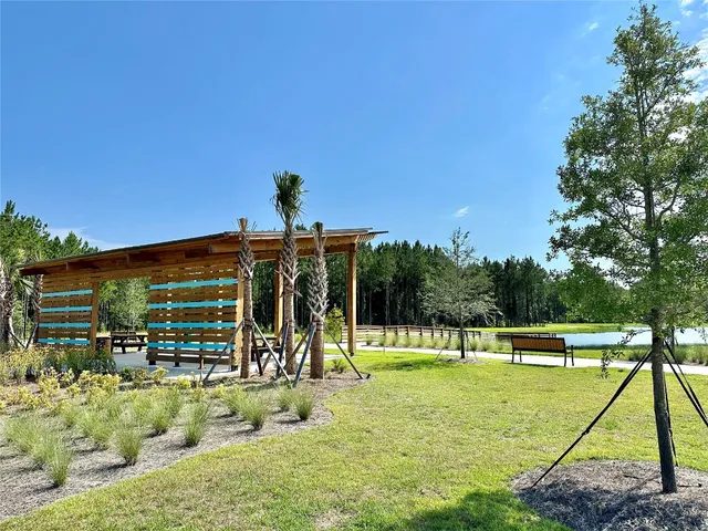 a view of a yard with a patio