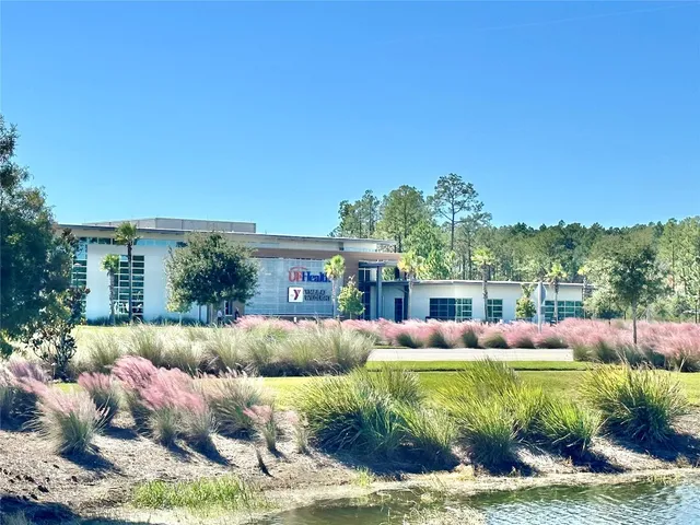 a front view of a house with garden and porch